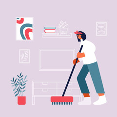 Woman cleaning floor in living room at home