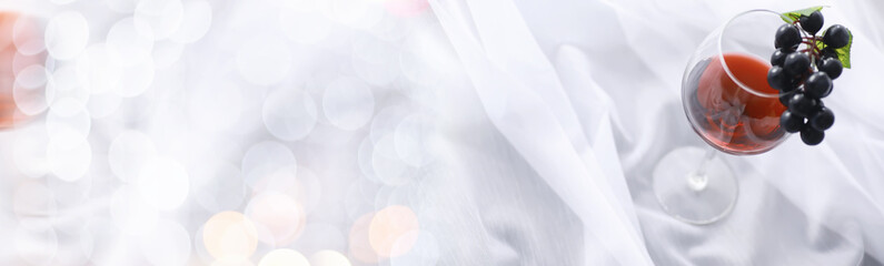 Glass with grape red semi-dry wine. Valentine's day concept background. Gift for the holiday. Sweet sparkling wine.
