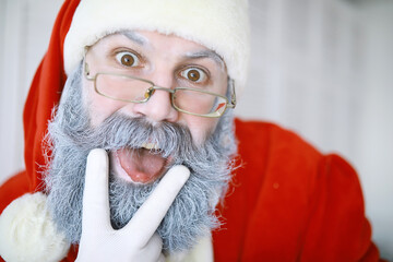 Portrait of real happy Santa Claus.Funny Santa. Theme Christmas holidays and winter new year Christmas are coming!