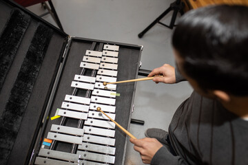 man playing metal xylophone percussion musical instrument