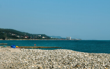 Fototapeta premium pebble beach on the black sea with a view of the city of Sochi