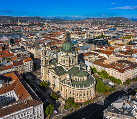 Obraz premium Budapest, Hungary - Aerial view of St.Stephen's Basilica on a sunny summer day with clear blue sky. Fisherman's Bastion, Matthias Church and Parliament building at background