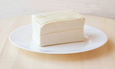 Tofu cheese on a plate. Vegetarian food