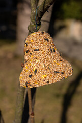 Bell from various grains, a delicacy for all the birds in the garden