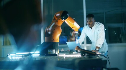 African researcher is experimenting with a robotic device