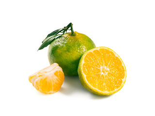 Green mandarines isolated on white background. Perfect fresh ripe green tangerine with leaf, half and slice green tangerines isolated on white with clipping path.