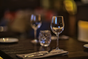 abstract background, restaurant concept blurred background evening food fork, knife, cutlery, table setting