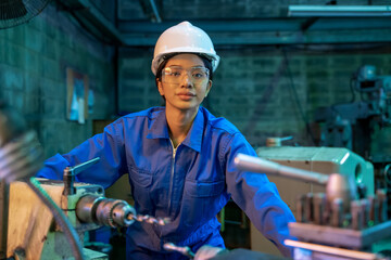 Engineering worker women in blue uniform working at factory,Engineering and industrial concept.