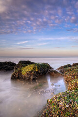 Fototapeta na wymiar Beautiful sunset on the beach. Seascape with an impressive blue, purple sky