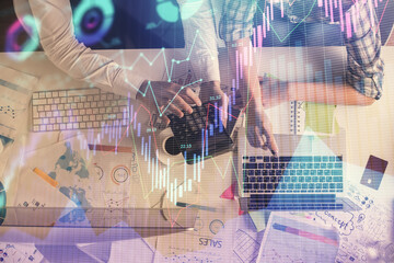 Double exposure of man and woman working together and financial graph hologram drawing. market analysis concept. Computer background. Top View.