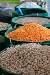 Uncooked assorted legumes. Healthy cereals in eco bags