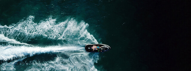 Aerial drone ultra wide photo of jet ski watercraft with couple cruising in high speed in Caribbean...