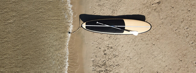 Aerial drone top down ultra wide photo of Stand Up Paddle surf board or SUP board as seen in...