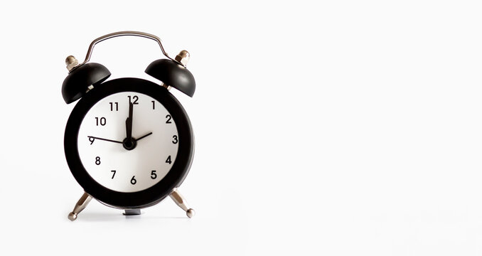 Black alarm clock isolated on white background , copy space