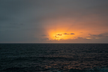Naklejka na ściany i meble sunrise over the sea early in the morning at Bronte Beach in Sydney Australia