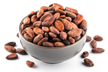 Cocoa beans in a bowl on a white background. Vegan food ingredients, side view.