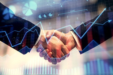 Double exposure of forex graph hologram and handshake of two men. Stock market concept.