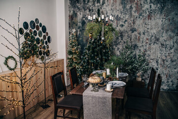 Christmas table with chairs in a room with festive decor