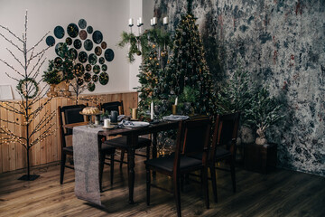 Christmas table with chairs in a room with festive decor