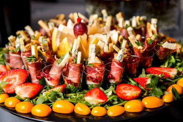 Beautifully decorated catering banquet table with different food snacks and appetizers with sandwich