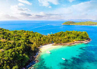 Aerial view of beautiful landscape, tourism boats, and people swimming on the sea and beach on May...