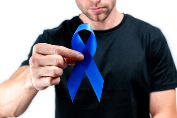 Cancer men. Awareness prostate of health in November. Hipster men in black shirt with blue ribbon in hands isolated on white background. Supporting people living and illness.