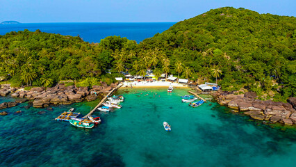 Aerial view of beautiful landscape, tourism boats, and people swimming on the sea and beach on May...