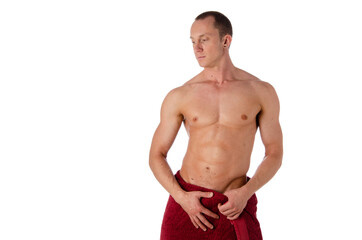 Naklejka premium Fashion portrait of strong brutal guy with a modern trendy hairstyle. Sexy torso. Male flexing his muscles. Sport workout bodybuilding.