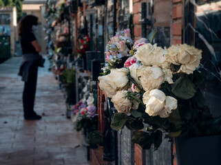 Closeup view of overriped roses in cemetery