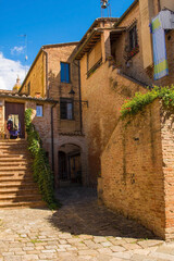Fototapeta na wymiar A residential building in the historic medieval village of Buonconvento, Siena Province, Tuscany, Italy 