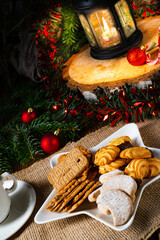 Obraz na płótnie Canvas Different types of biscuits with rustic Christmas decorations