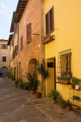 Fototapeta na wymiar A quiet residential back street in the historic medieval village of Buonconvento, Siena Province, Tuscany, Italy 
