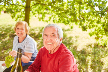 Smiling senior picnic with elderly woman