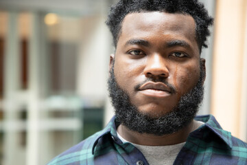 Sad African black man crying with tear stain on his face