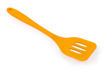 Plastic bendable kitchen spatula on a white background