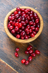 Dogwood berries in a wooden bowl