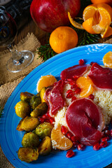 Cured goose breast with Brussels sprouts, mandarins and pomegranate