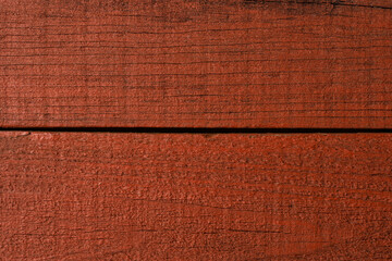 Fototapeta premium Red wooden background with copyspace. Texture