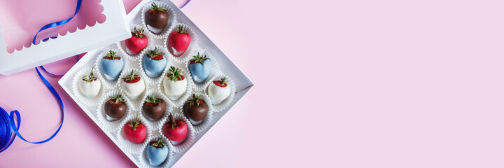 Great festive background with free space. Chocolate covered strawberries in a gift box on a pink background, dessert for Valentine's Day, romance, food as a gift. Romantic postcard with free space.