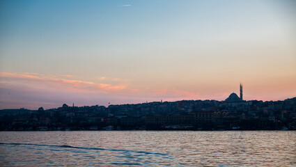 Fototapeta premium Houses and mosque high contrast skyline at sunset in Istanbul, Turkey