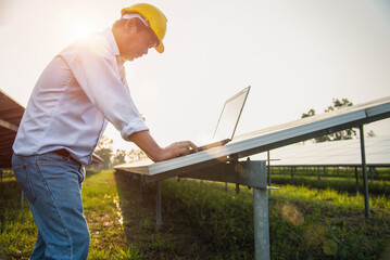 The engineer is checking the solar cell power system. - Image