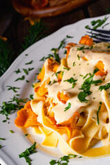 Tagliatelle with fresh chanterelles in a mushroom sauce