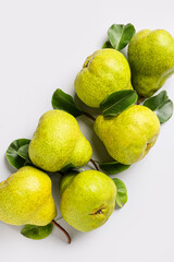 Fresh ripe pears on light background