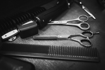 combs and scissors for haircuts lie on a shelf in the cabin