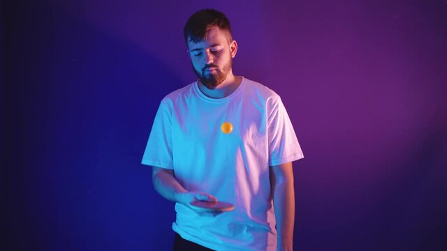 Young man in white jersey holding a tennis racket - Powered by Adobe