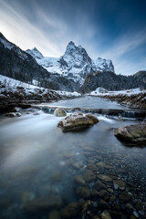 Fototapeta na wymiar winter in Rosenlaui with Wellhorn and mountain creek Rychenbach, Switzerland
