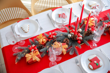 Obraz na płótnie Canvas Beautiful table setting with Christmas decorations in living room