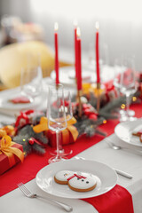 Beautiful table setting with Christmas decorations in living room