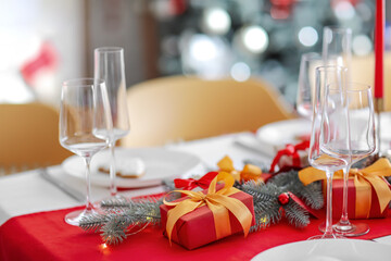 Beautiful table setting with Christmas decorations in living room