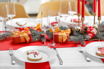 Beautiful table setting with Christmas decorations in living room